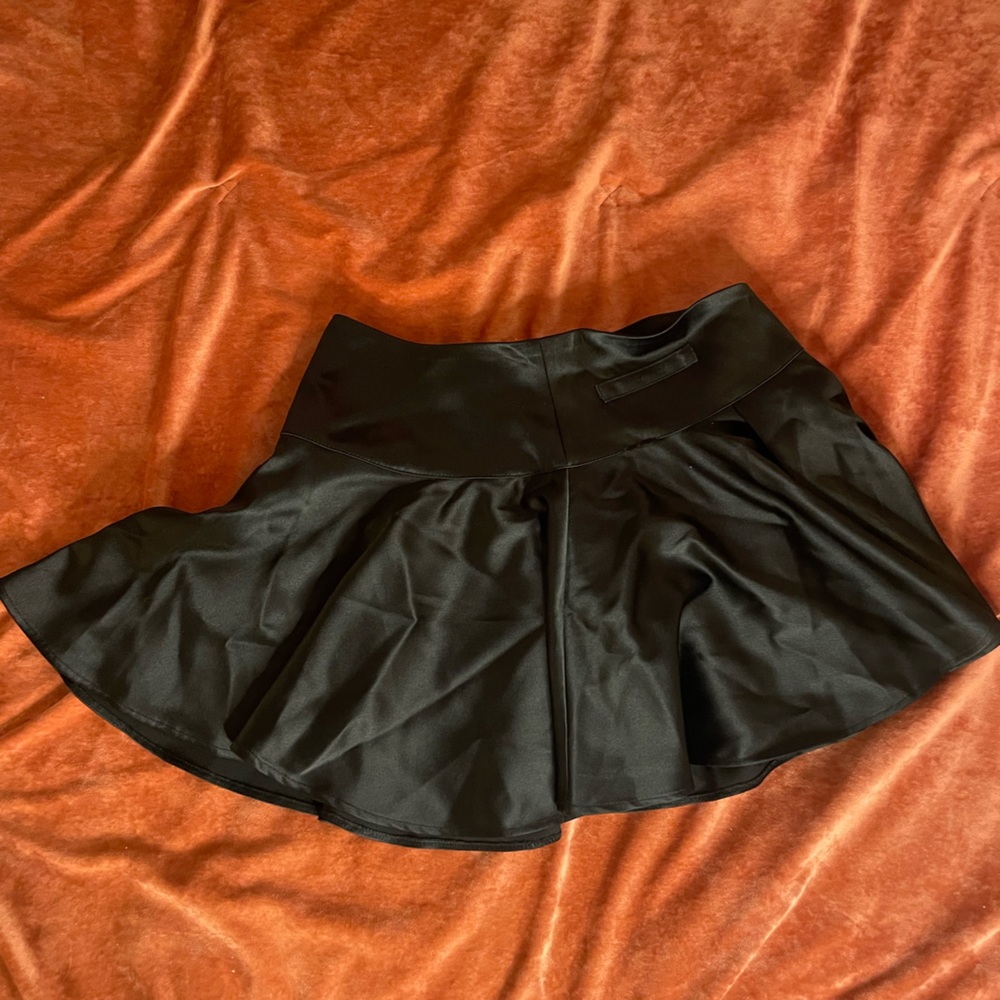 Flouncy black skirt with zippered waist.